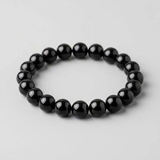 Bracelet homme en obsidienne noire naturelle Kynstone avec perles rondes noires premium.