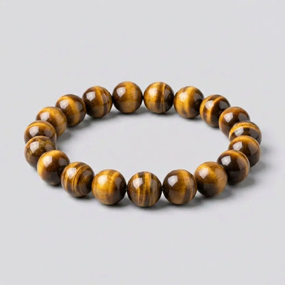 Bracelet homme en pierre naturelle œil de tigre Kynstone avec perles premium marron et dorées.
